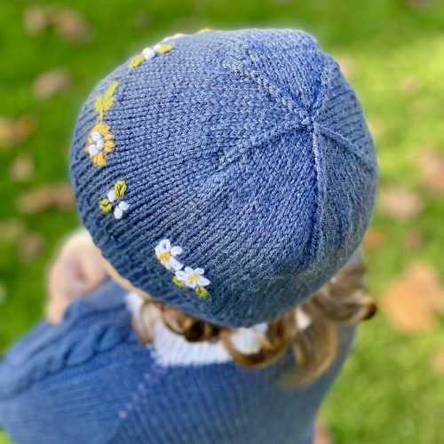 Fitted version of the William's Hat with embroidery in Ocker, Olive, and White, matching the Vine Pullover.