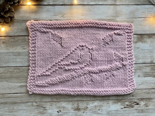 Finished Bird Square on a wooden surface