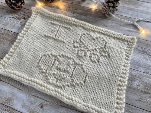 The finished I Love Dogs Square in white on a wooden surface