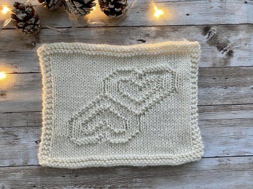 Finished Mirror Hearts Square on a wooden surface