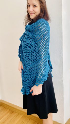 he Durable Friendship shawl wrapped around shoulders, evoking warmth and nostalgia