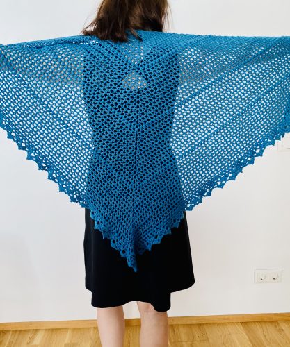 he Durable Friendship shawl wrapped around shoulders, evoking warmth and nostalgia