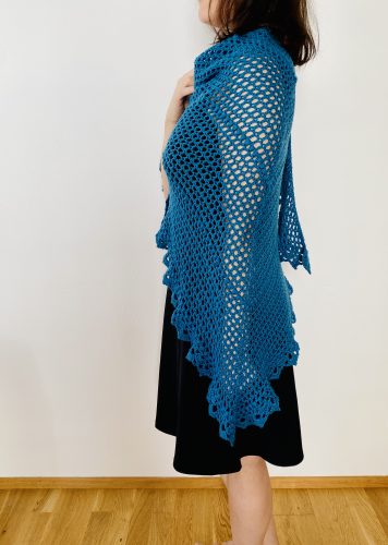 he Durable Friendship shawl wrapped around shoulders, evoking warmth and nostalgia