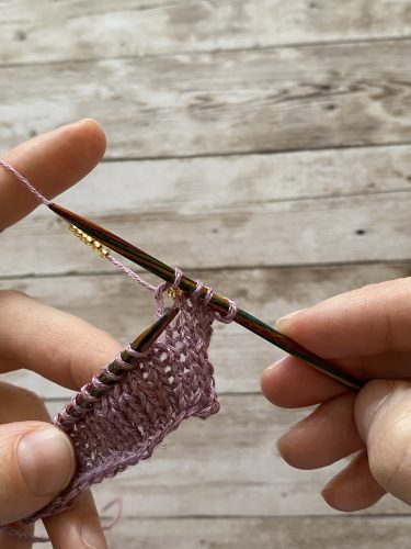 Step-by-step tutorial image demonstrating one of three techniques for threading beads onto yarn for knitting: using a hook, dental floss or thread, or pre-threading. The image shows the tools, materials, and process clearly to guide the viewer through the technique.