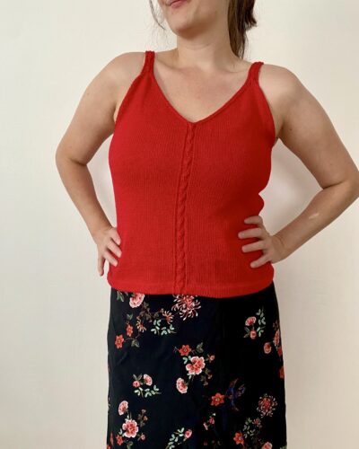A front view of the completed Ginkgo Biloba Top, worn by me. The sleeveless, fitted design features a V-neckline and a central lace panel, paired with a floral skirt for a summery look.