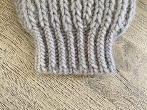 A close-up of the Fluffy Daisy Cardigan, showcasing the cuff