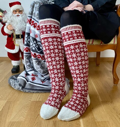 Hand-knit red and white Christmas socks with Lang Yarns Super Soxx
