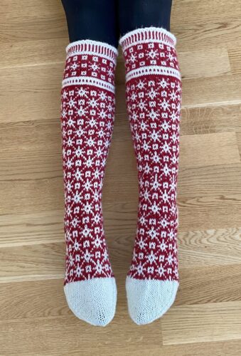 Hand-knit red and white Christmas socks with Lang Yarns Super Soxx