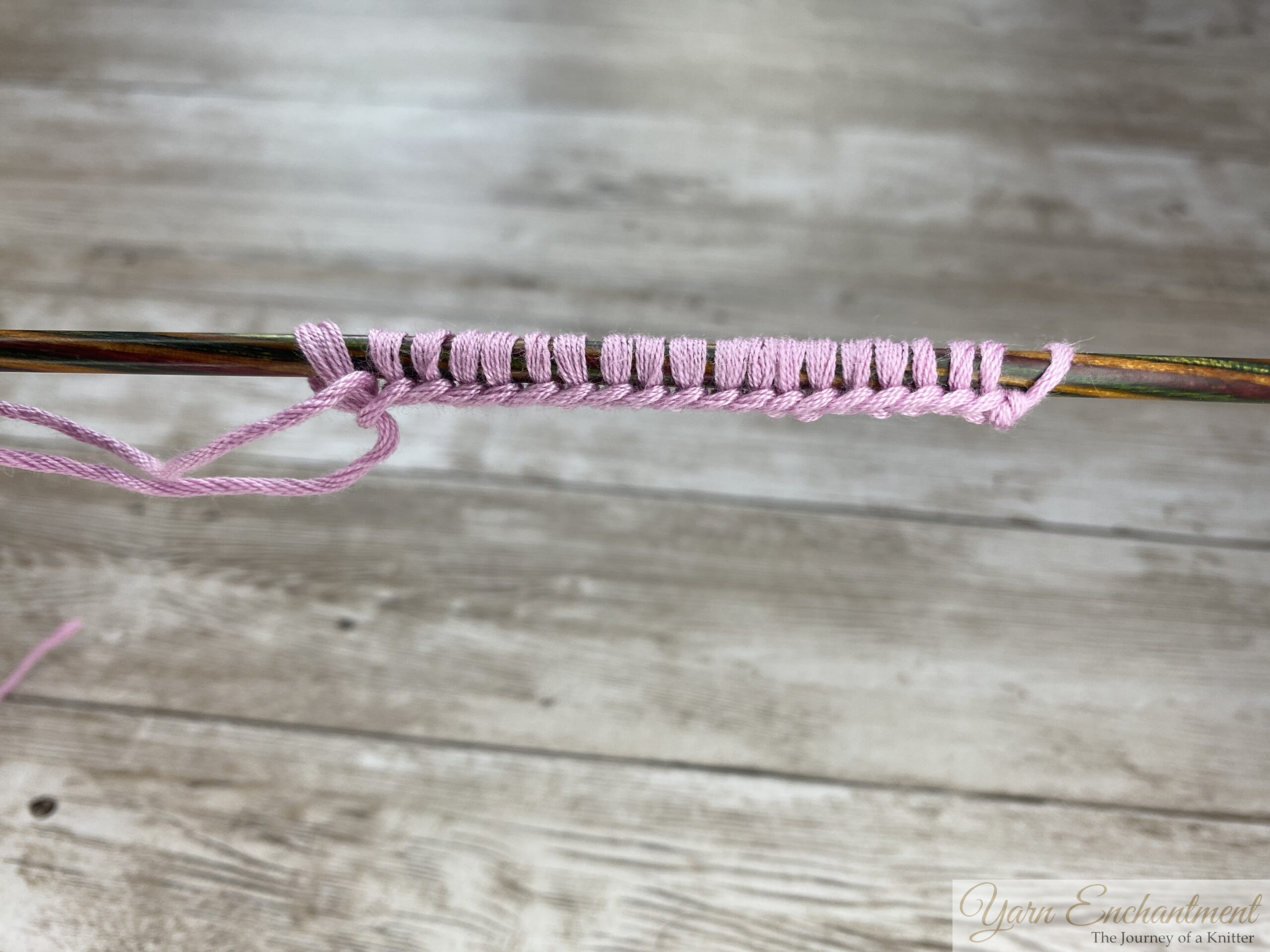 A picture from the finished long tail cast on with pink yarn