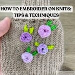 Close-up of a beige knitted hat with three embroidered purple flowers and green leaves, with bold heading text reading "How to Embroider on Knits: Tips & Techniques" across the top.