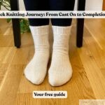 Hand-knitted cream-colored socks worn on feet, shown against a wooden floor with the blog post title 'Sock Knitting Journey: From Cast On to Completion' displayed across the center. Highlights the finished result of a complete sock knitting masterclass guide.