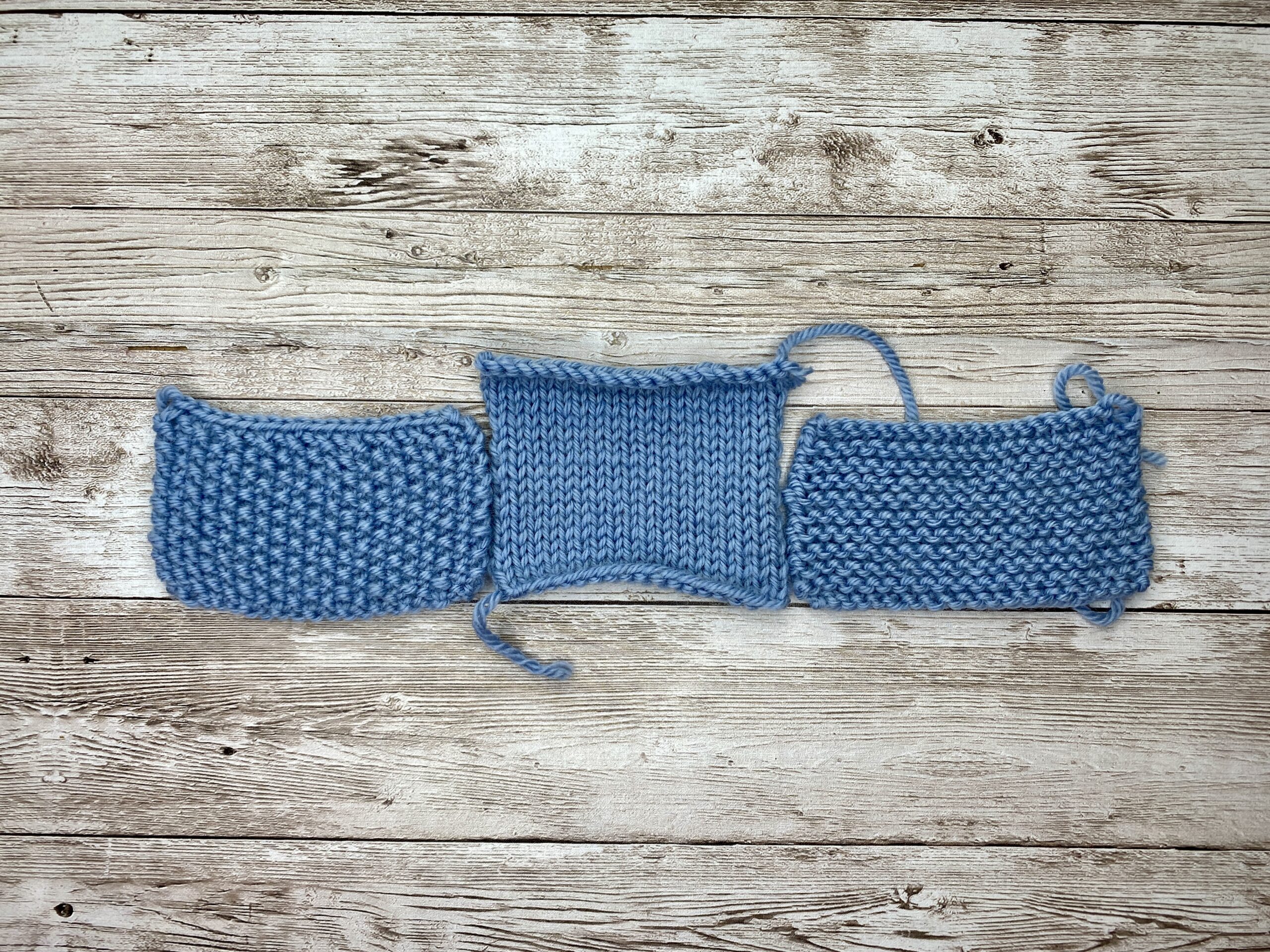 Blue gauge swatch with garter border joined to a borderless blue swatch to compare length and width