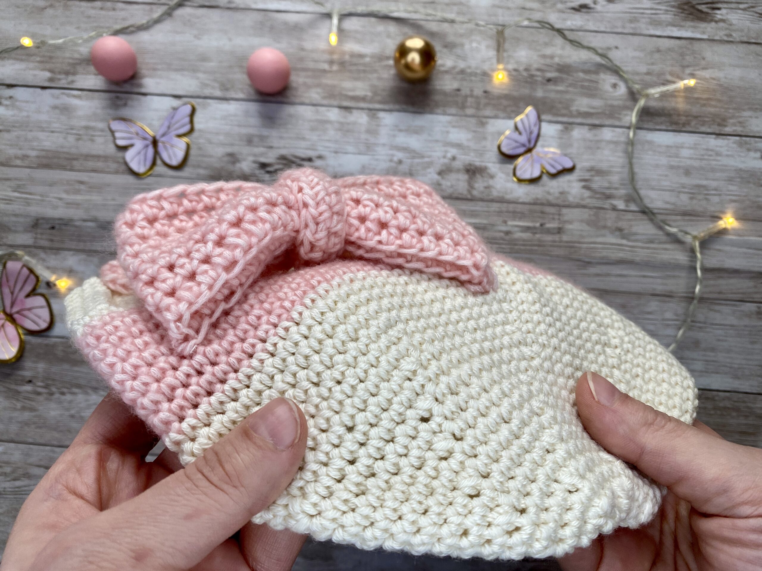 Blushbow Beanie – cream and blush crochet hat with an oversized bow, handmade as a special gift from mother to daughter.