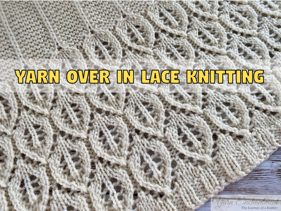 Close-up of cream lace knitting with leaf holes and the text 'Yarn Over in Lace Knitting' overlaid in the center.