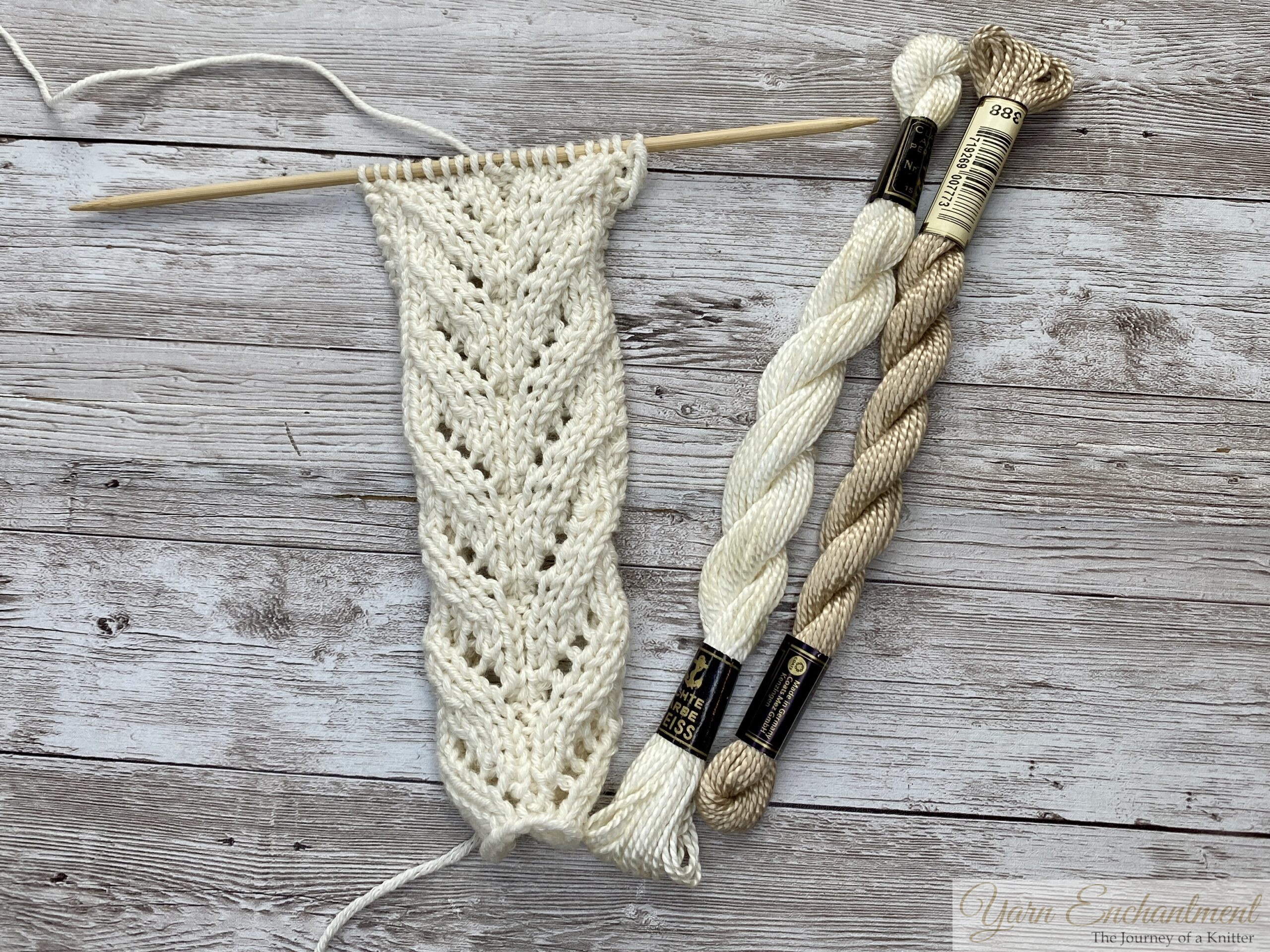 Cream lace swatch next to cream and beige pearl cotton skeins — lifeline colors that blend into light yarn, best avoided.