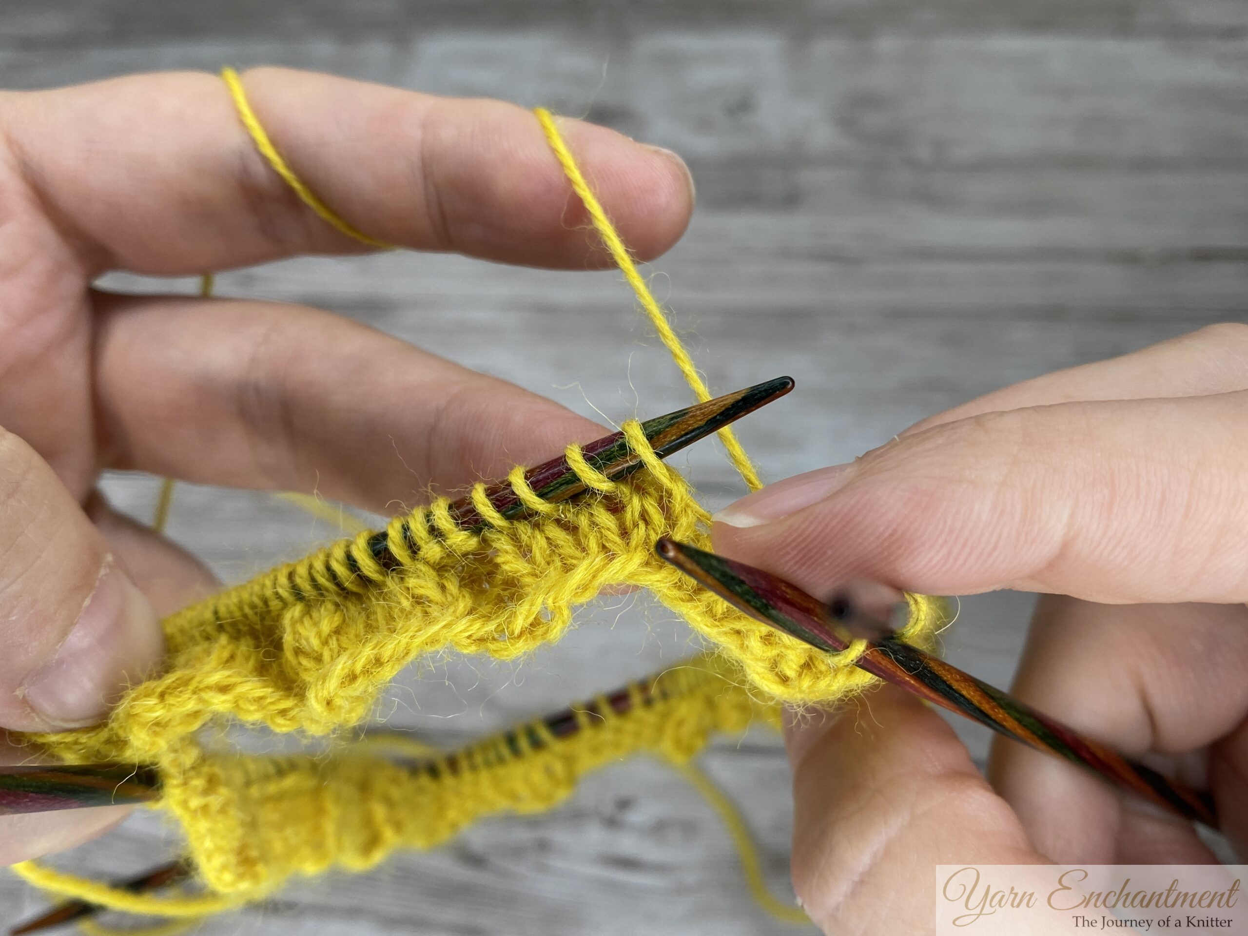 Knit the next two stitches with yellow sock yarn