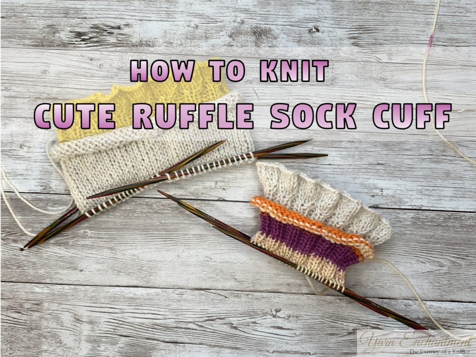 Two sock cuffs with ruffled edges in yellow and cream yarn resting on wooden knitting needles